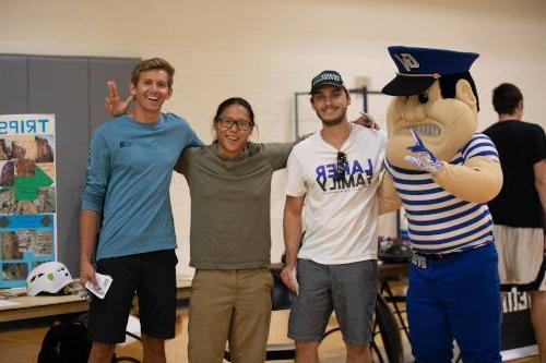 Louis the Laker with students